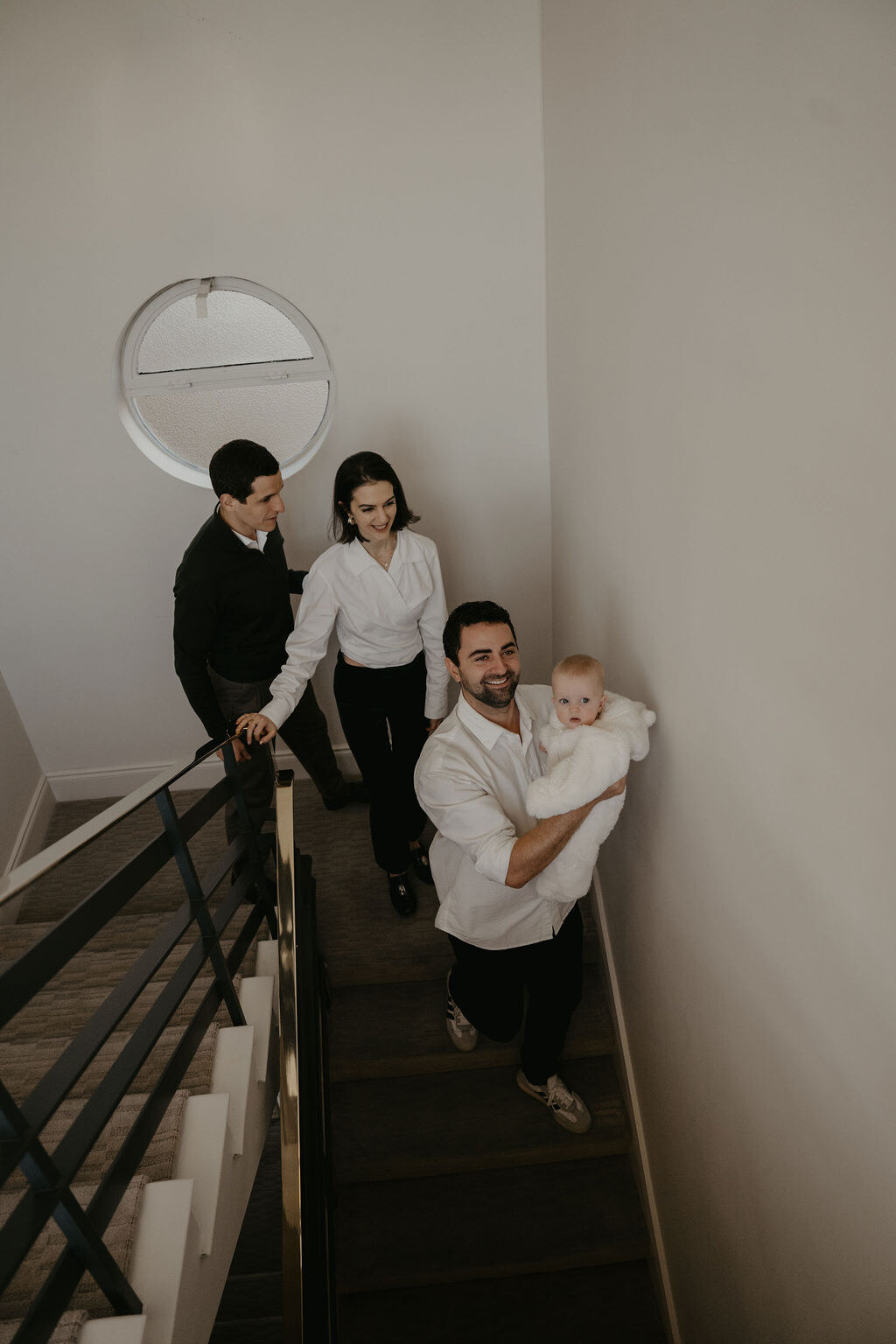 The family on the staircase with Amira