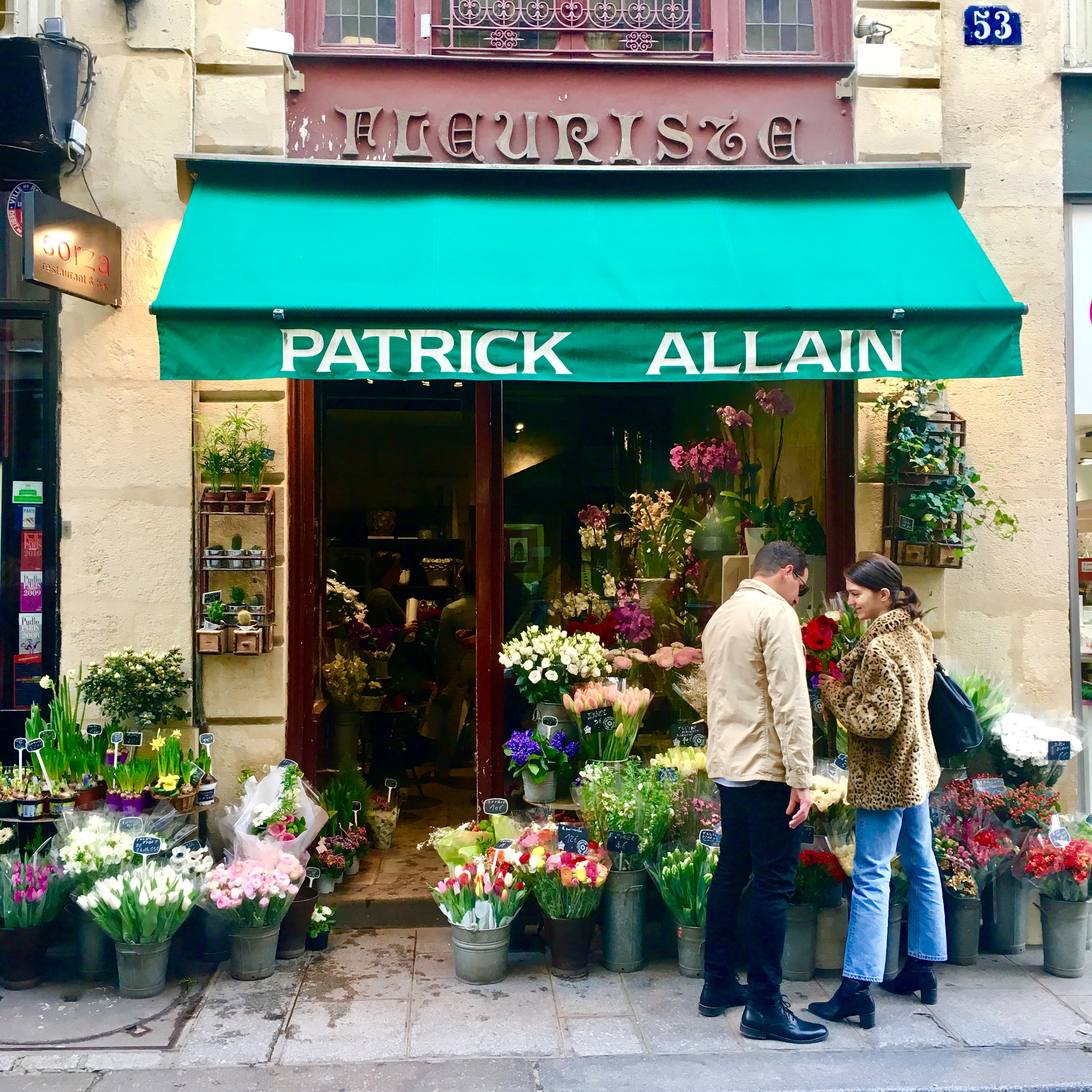 Amanda and Mohamed at a Paris flower shop